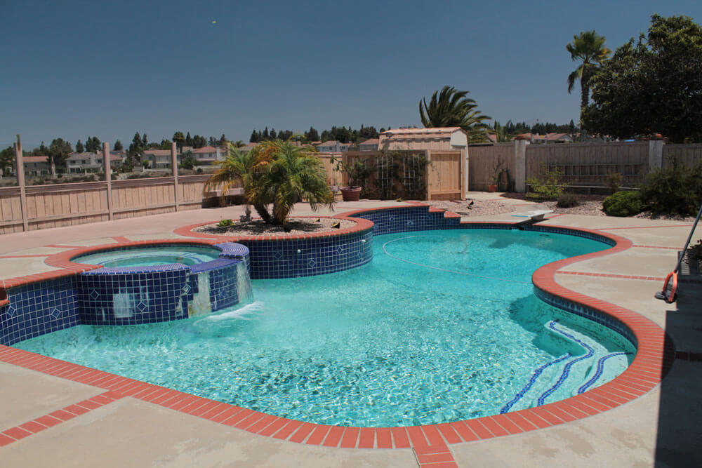 Freeform-Pool-with-Raised-Spa-Before-Renovation
