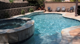 Freeform-Pool-with-Raised-Spa-and-French-Grey-Finish-min