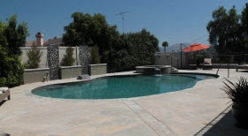 Freeform-Pool-with-Raised-Spa-and-Tahoe-Finish