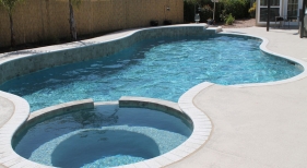 Freeform Pool and Spa with Raised Wall and Aqua Blue Finish